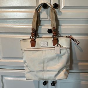 Coach bag, leather handles, coach leather tag in a nice warm orange.